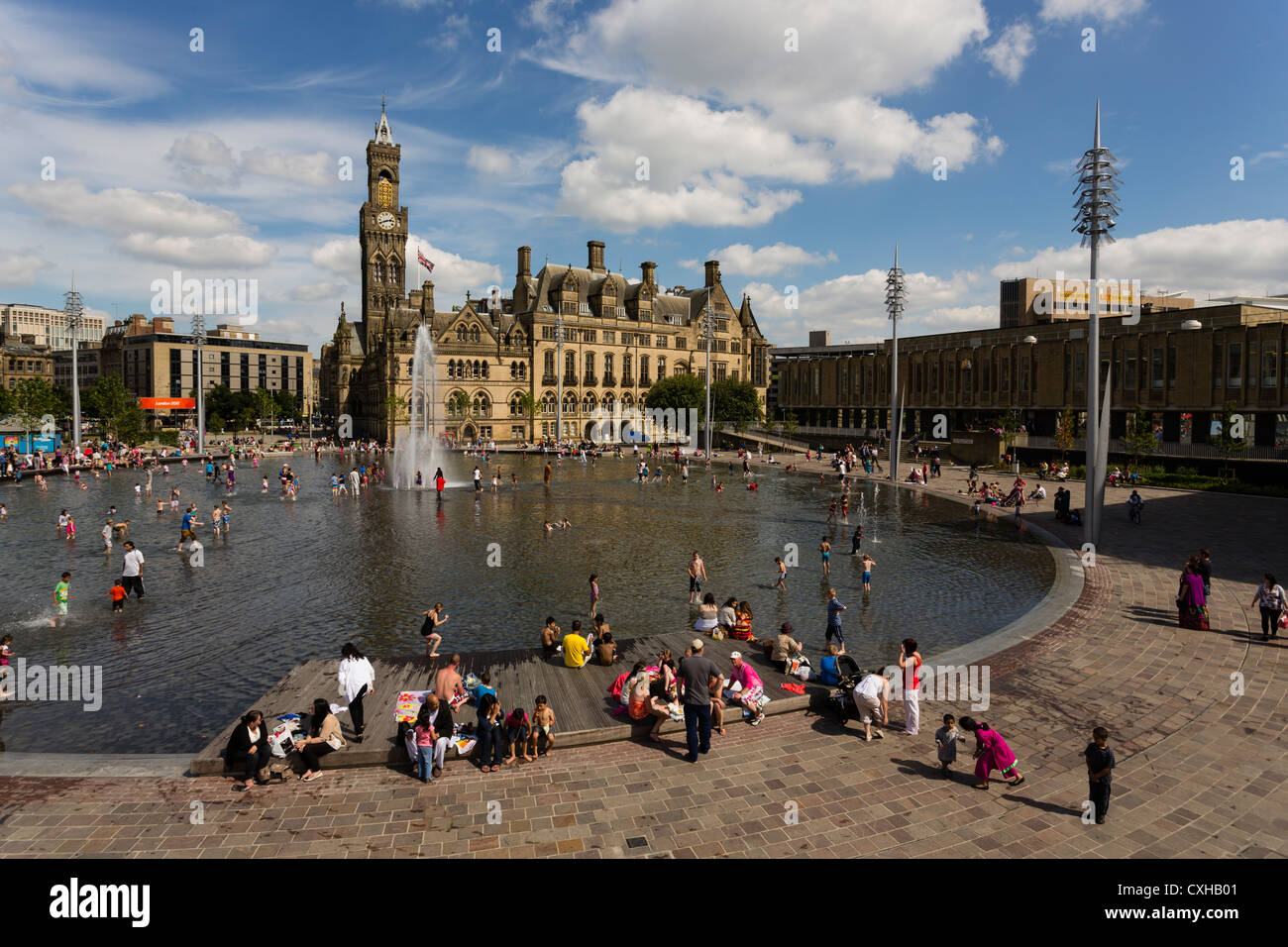 People enjoying the City Park water feature in Centenary Square