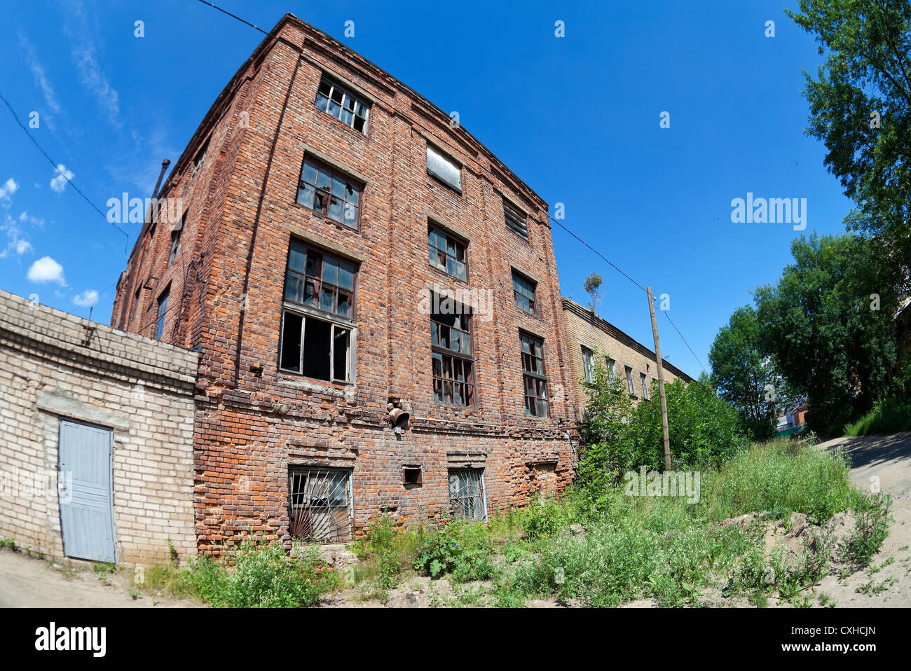 Old abandoned building against blue sky in summer day Stock Photo - Alamy