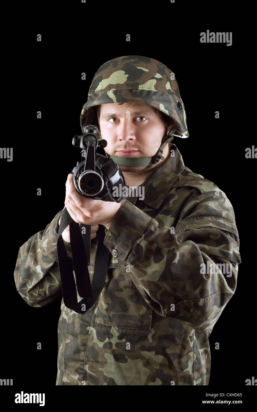 Armed man pointing a rifle Stock Photo Alamy