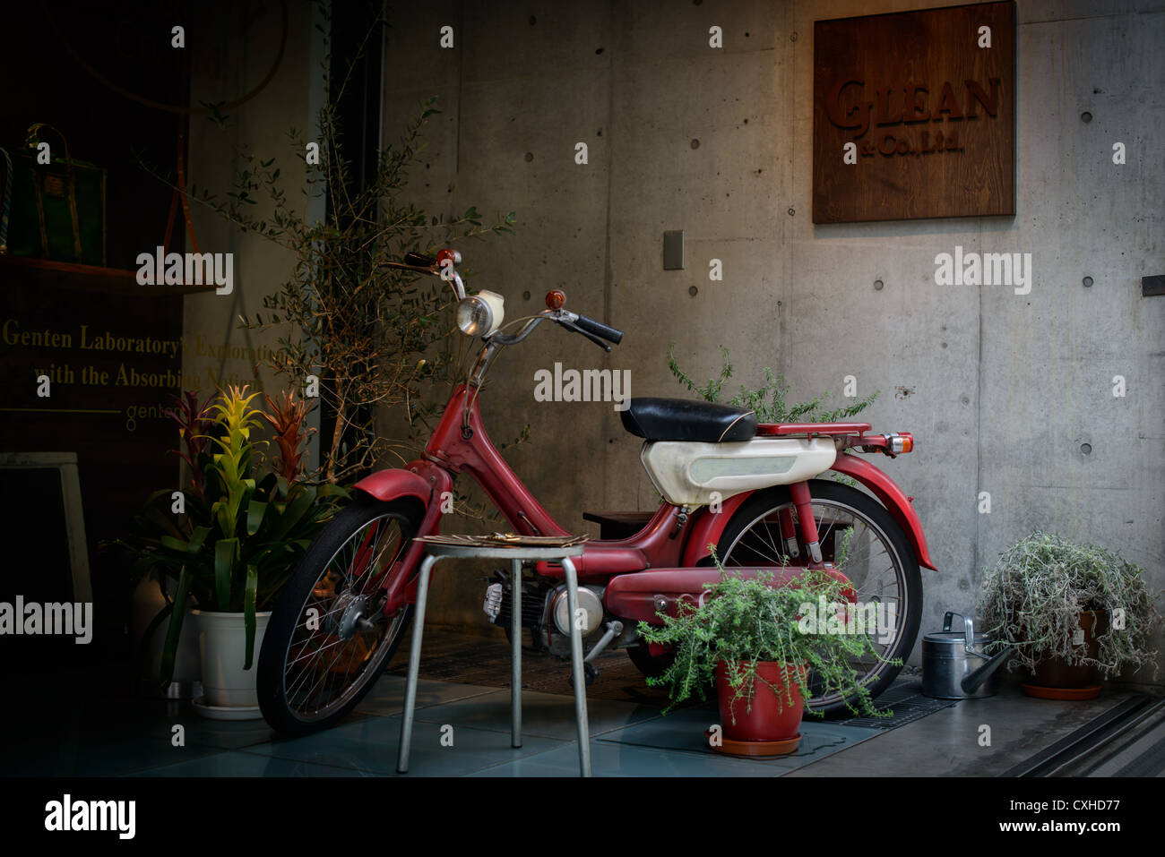 Antique Japanese motorcycle in boutique shop front in Harajuku, Tokyo, Japan Stock Photo