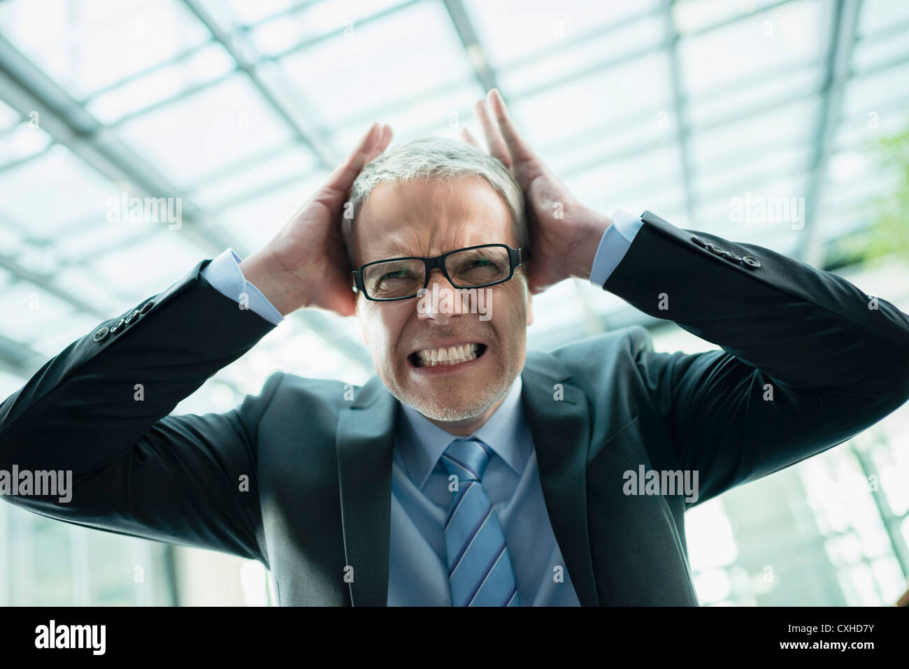 Germany, Stuttgart, Angry businessman, close up Stock Photo