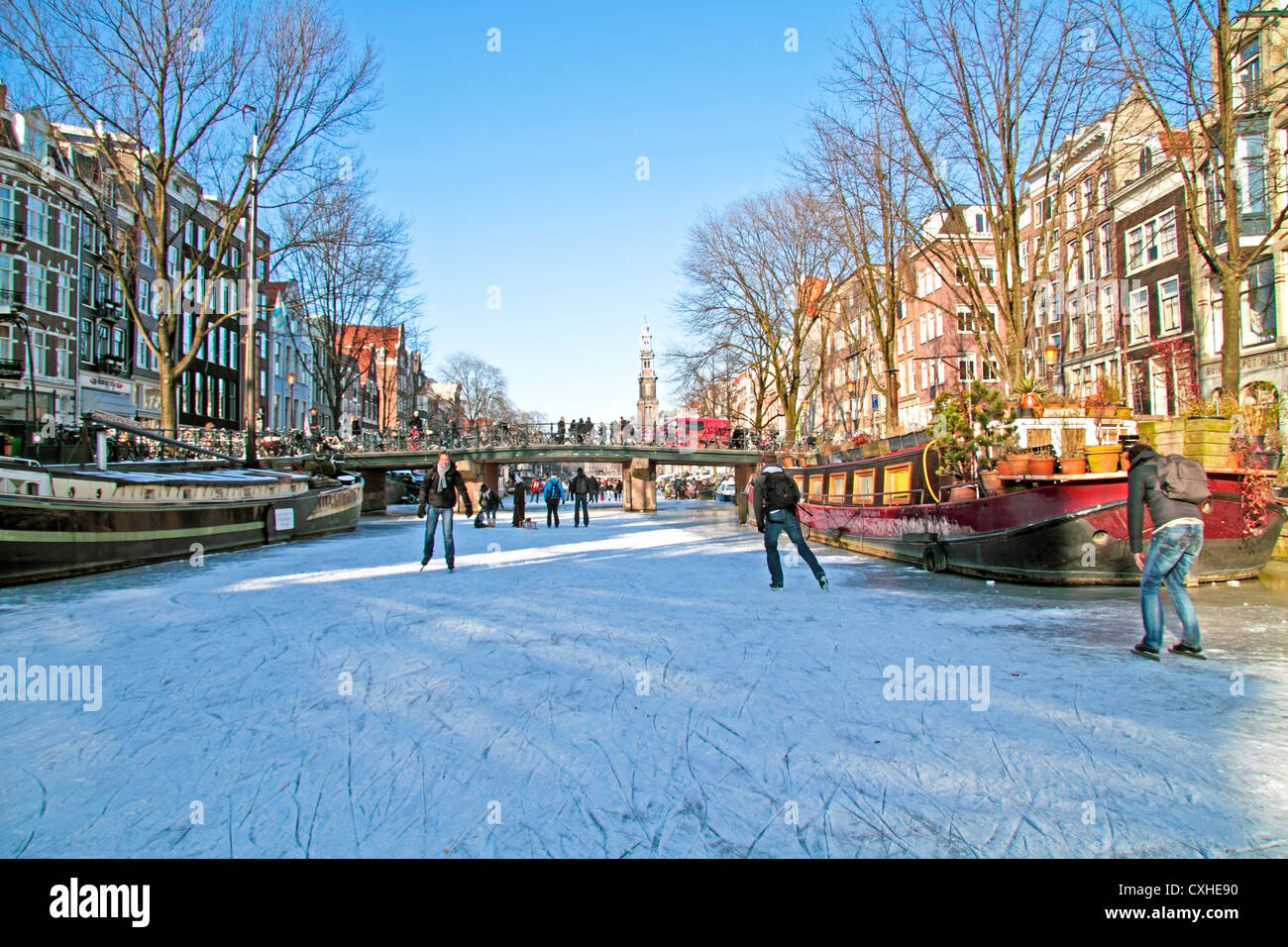 Ice skating on the canals in Amsterdam the Netherlands in winter Stock