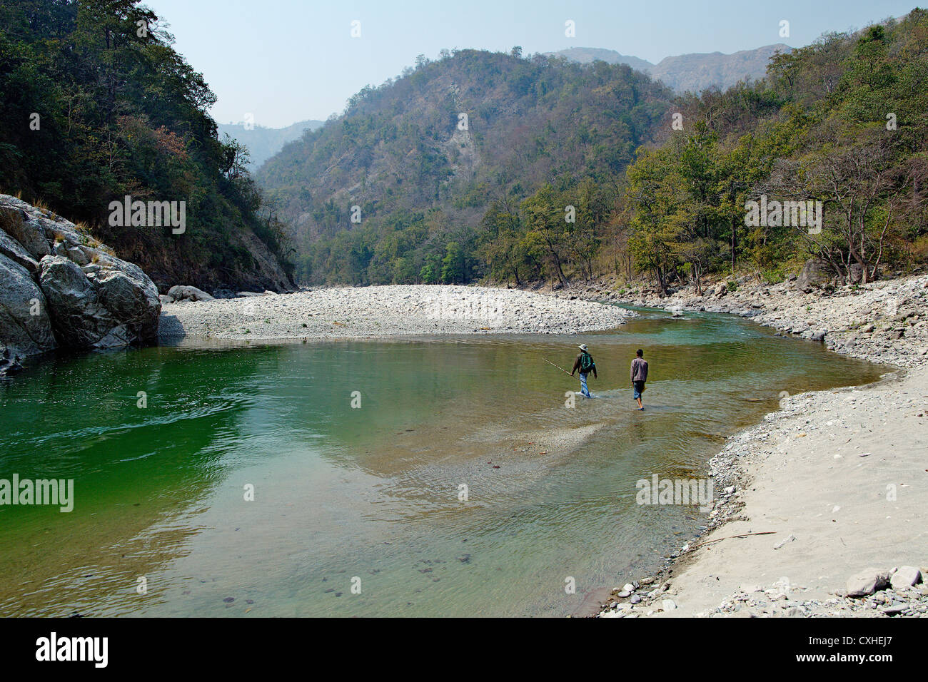 Anglers crossing Ramganga river in Vanghat area, Jim Corbett Tiger Reserve, India. Stock Photo