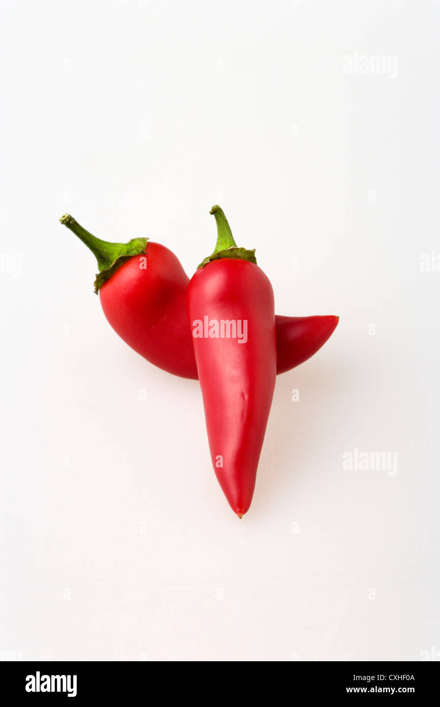 Red chilli peppers on white background Stock Photo - Alamy