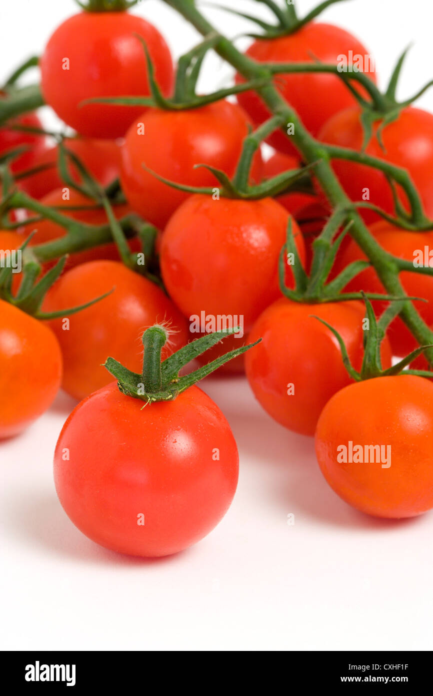 Ripe red cherry tomatoes on white background Stock Photo - Alamy