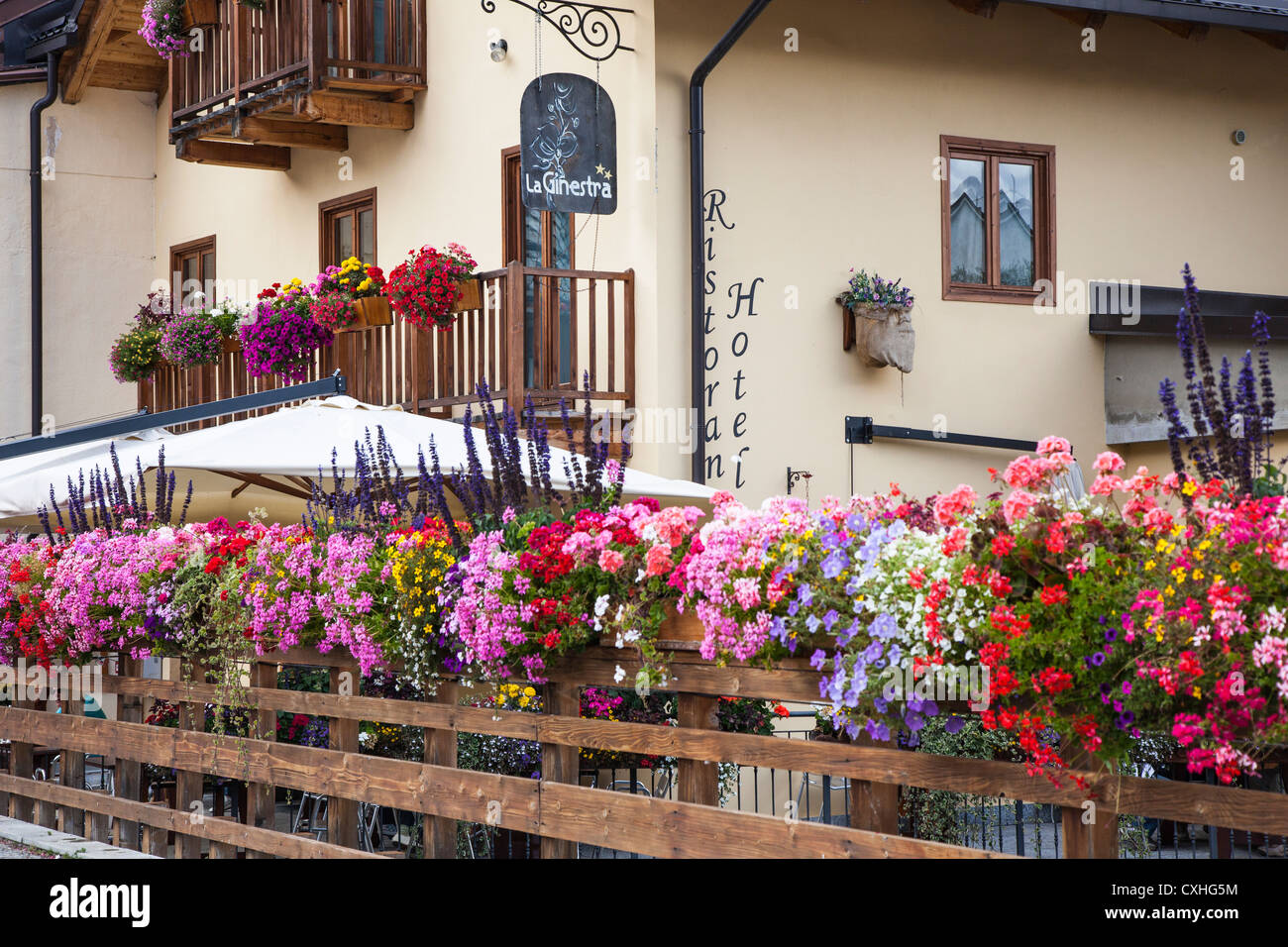 Summer flowers decorating the bridge at Cesana Torinese, Piemonte, Italy. Stock Photo