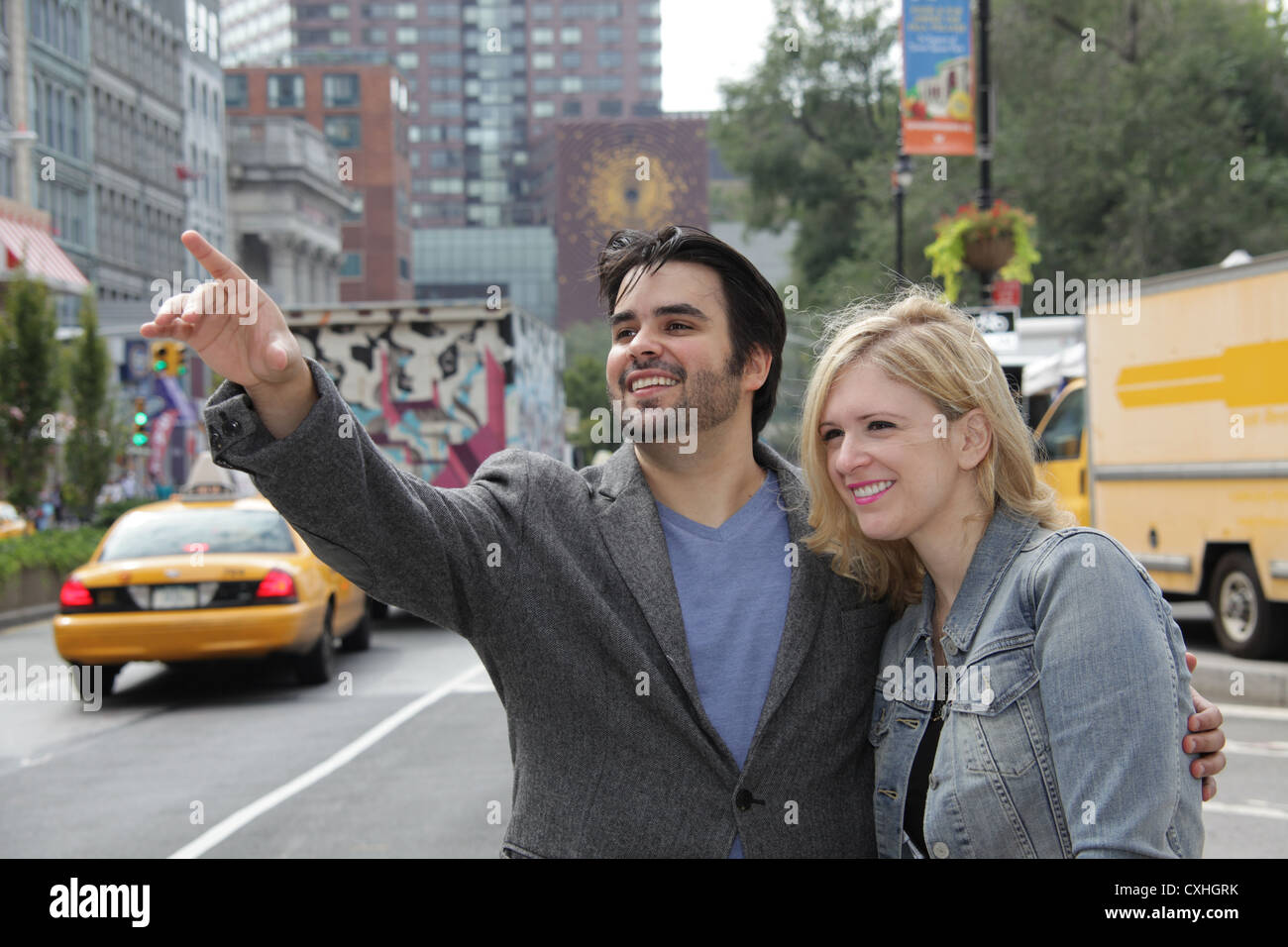 Couple hailing taxi along Union Square East in New York City, USA, September 26, 2012 © Katharine Andriotis Stock Photo