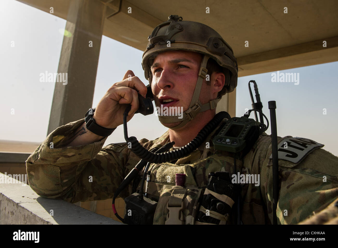 U.S. Air Force 1st Lt. Drew Parks, Joint Terminal Attack Controller, 82nd Expeditionary Air Support Operations Squadron, communicates with a U.S. Navy F/A-18 Super Hornet on Sept. 11, 2012, Southwest Asia. JTAC's are qualified to coordinate and control all attack air assets, surface-to-surface and unmanned aerial vehicles from all branches of the U.S. and Multi-National Military. Parks hometown is Hampstead, N.C. Stock Photo