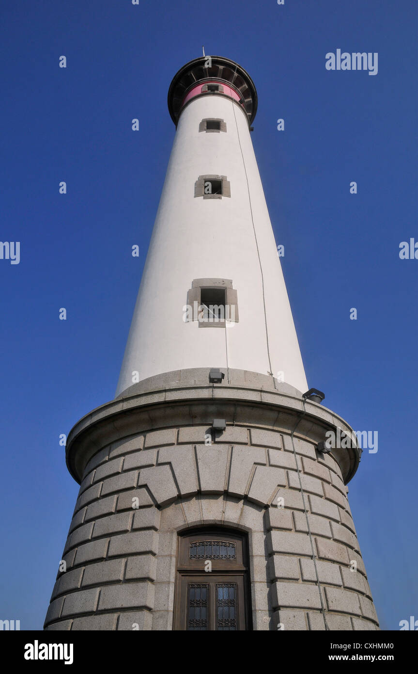 Lighthouse of Ouistreham on the blue sky background in the Calvados department in the Basse-Normandie region in France Stock Photo