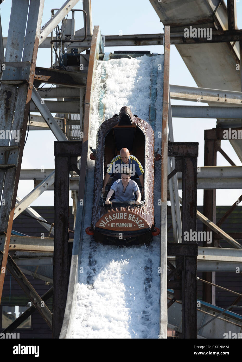 father and son enjoying a ride on the log flume pleasure beach great yarmouth norfolk england uk Stock Photo