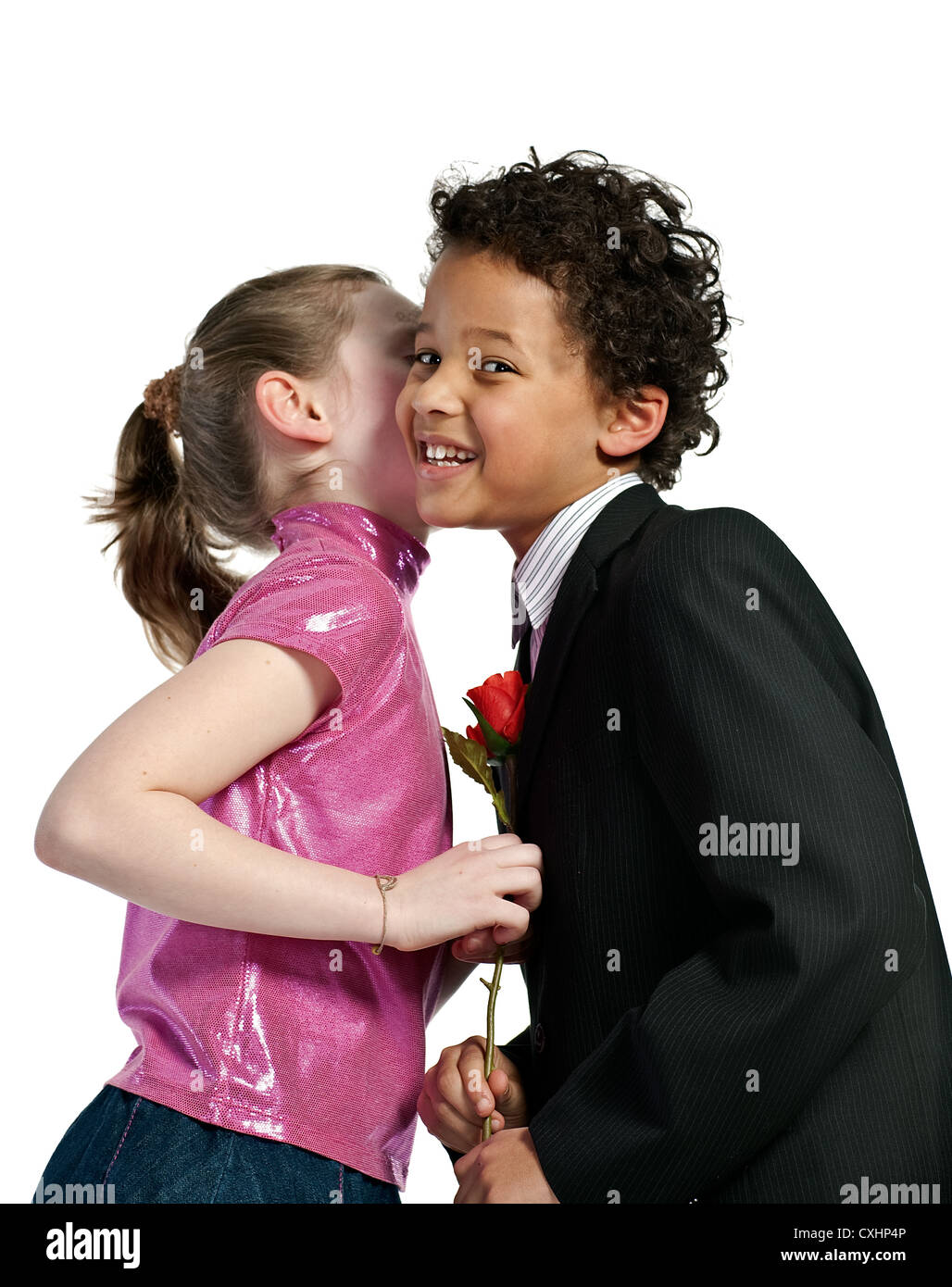 Cute little girl kissing a boy Stock Photo - Alamy