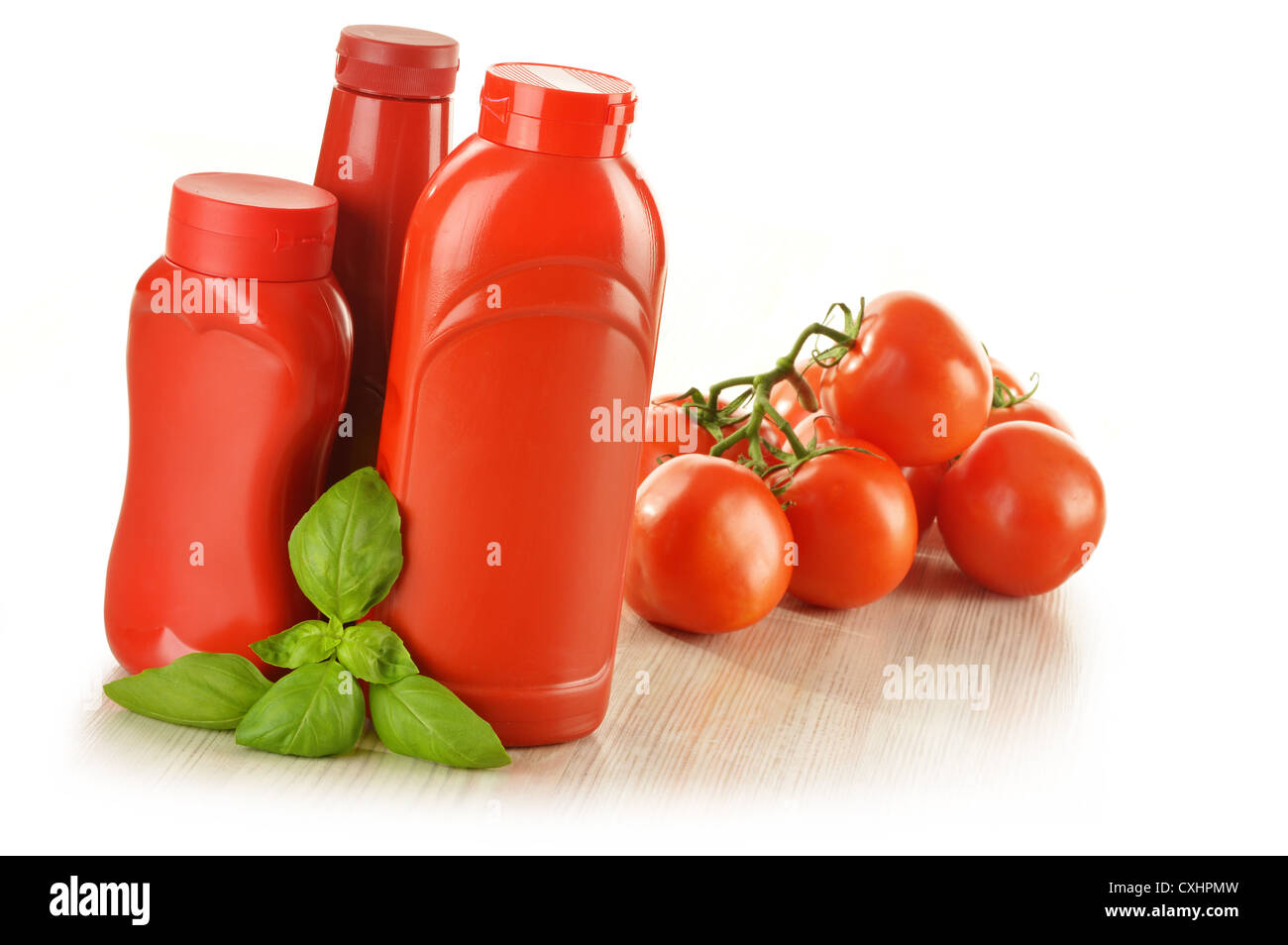 Composition with ketchup and fresh tomatoes isolated on white Stock Photo