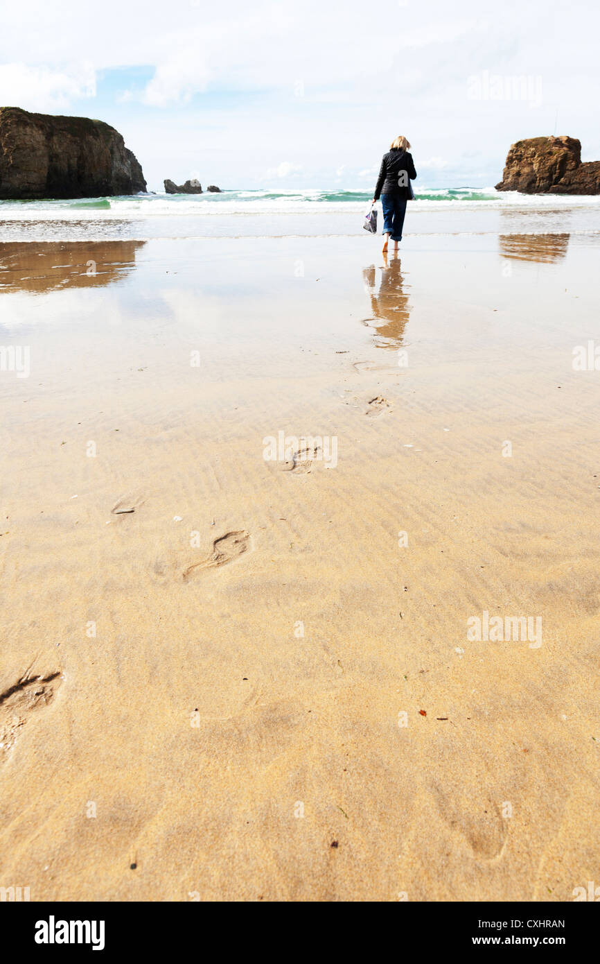footprints & footsteps in the sand walking to the top of frame on Perranporth  Perrenporth beach in Cornwall  suicide Stock Photo