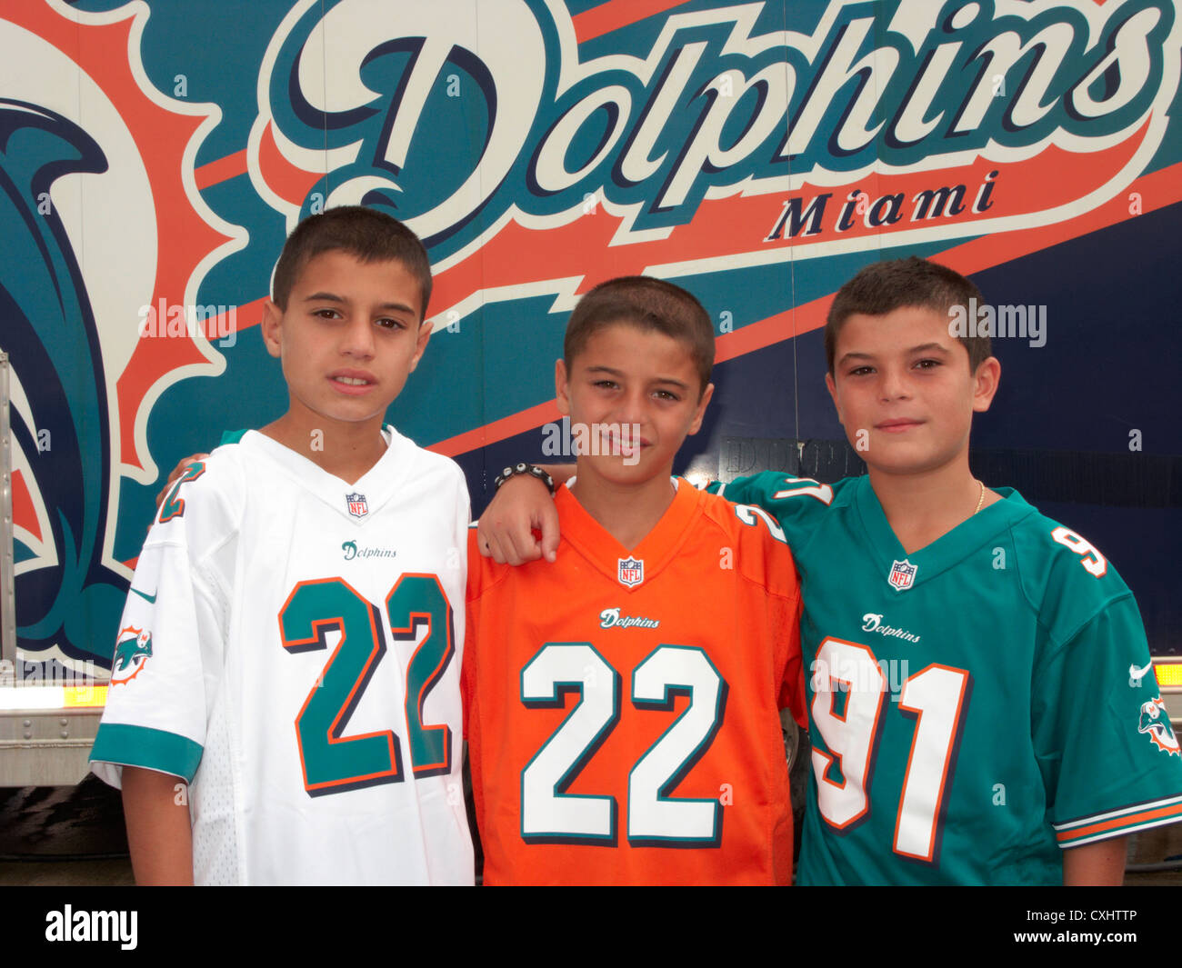 three young miami dolphins fans outside sun life stadium miami florida usa Stock Photo