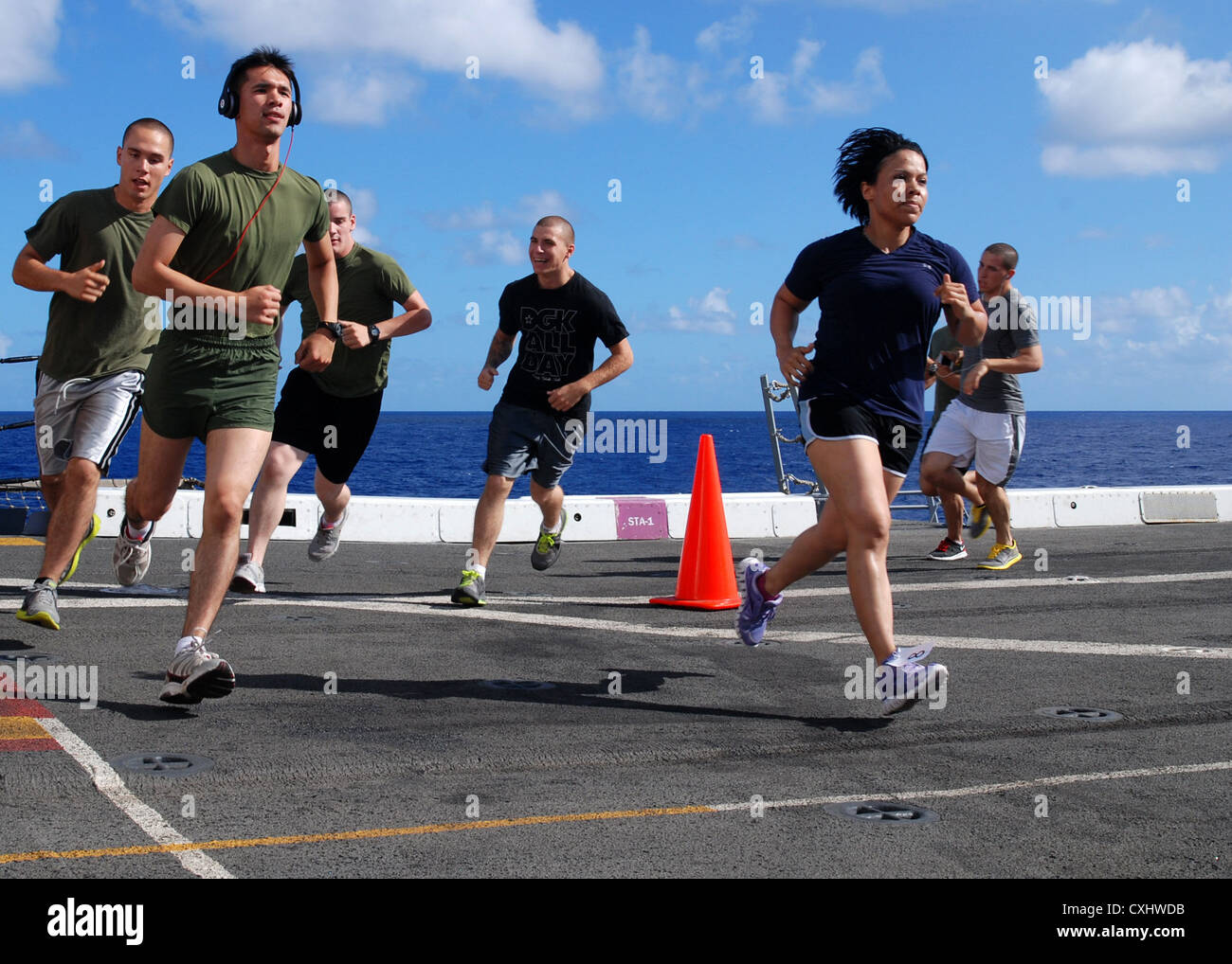 Service members aboard amphibious transport dock ship USS Green Bay (LPD 20) participate in the Landaker 5k held by the “Purple Foxes” of Marine Medium Helicopter Squadron (HMM) 364 (REIN). Green Bay is part of the Peleliu Amphibious Ready Group currently underway on a Western Pacific deployment with amphibious assault ship USS Peleliu (LHA 5) and amphibious dock landing ship USS Rushmore (LSD 47). Stock Photo