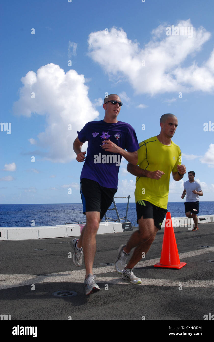 Capt. Charles Jordan and Capt. Adam Bittner round the corner during the Landaker 5k held by the â€œPurple Foxesâ€ of Marine Medium Helicopter Squadron (HMM) 364 (REIN) aboard amphibious transport dock ship USS Green Bay (LPD 20). Green Bay is part of the Peleliu Amphibious Ready Group currently underway on a Western Pacific deployment with amphibious assault ship USS Peleliu (LHA 5) and amphibious dock landing ship USS Rushmore (LSD 47). Stock Photo