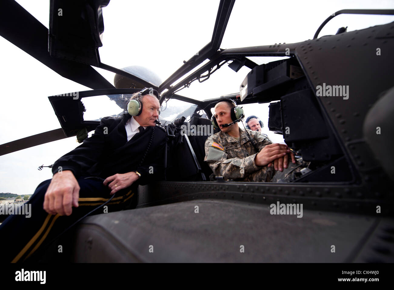 US Army General Martin E. Dempsey, chairman of the Joint Chiefs of Staff, receives a brief on the capabilities of the Grayhawk and Apache Block 3 aircraft during a visit October 1, 2012 to Ft. Riley, KS. Stock Photo