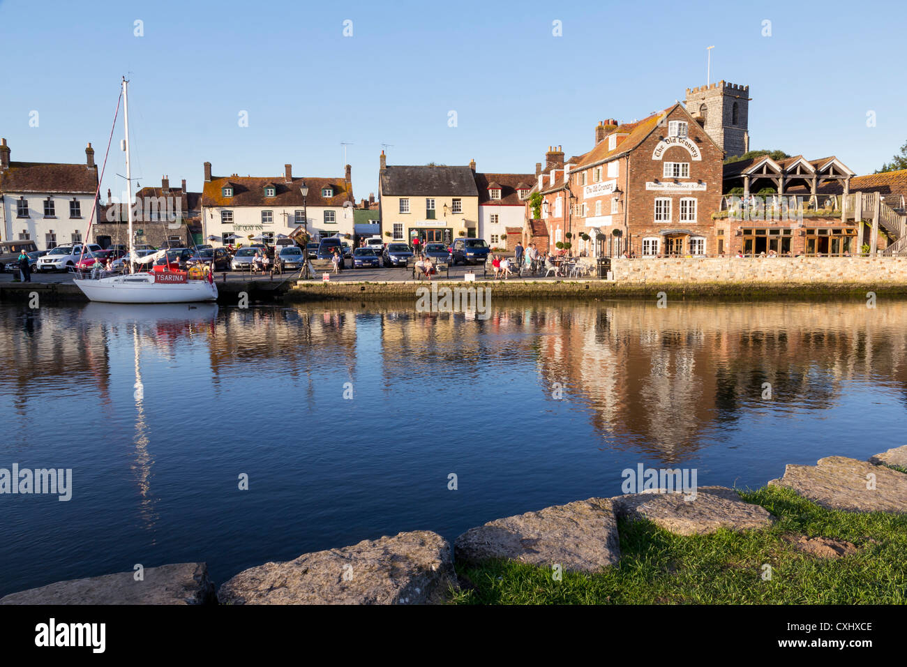 Wareham Quay Dorset England on the River Frome with the Old Granary and the Church of Lady St. Mary. Stock Photo