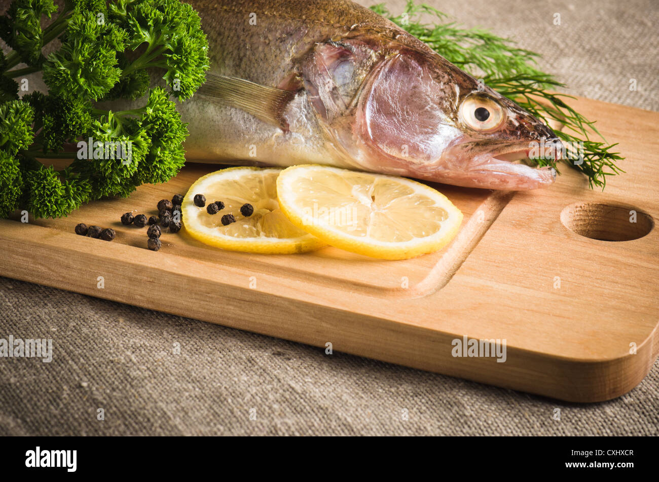 Pike perch on a wooden kitchen board Stock Photo