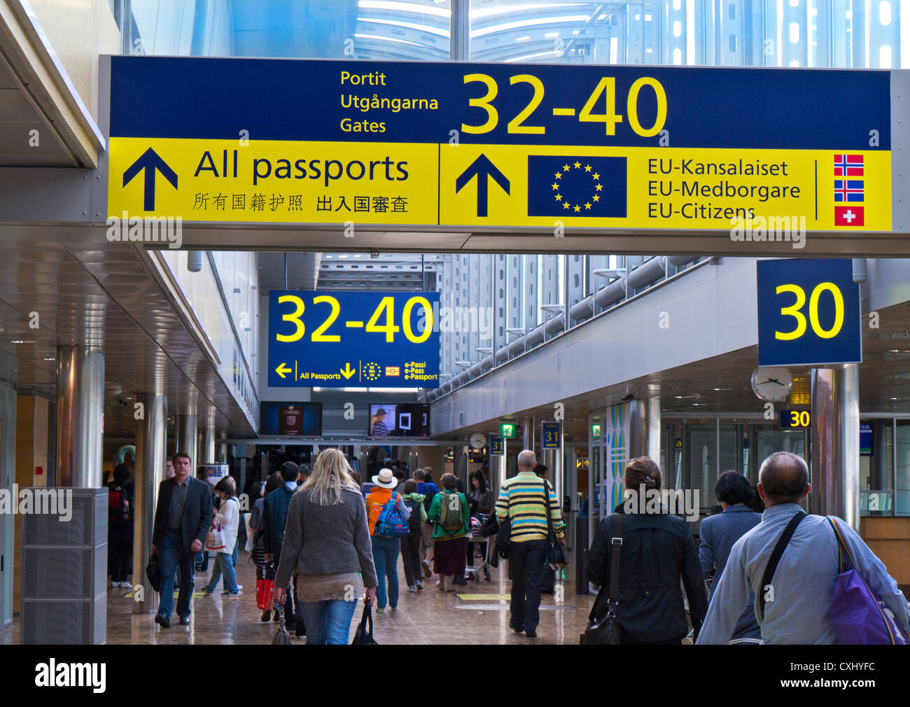 Airport Passengers HELSINKI  EU signs airside on concourse to border control and departure boarding gates at Vantaa Helsinki airport Finland Stock Photo