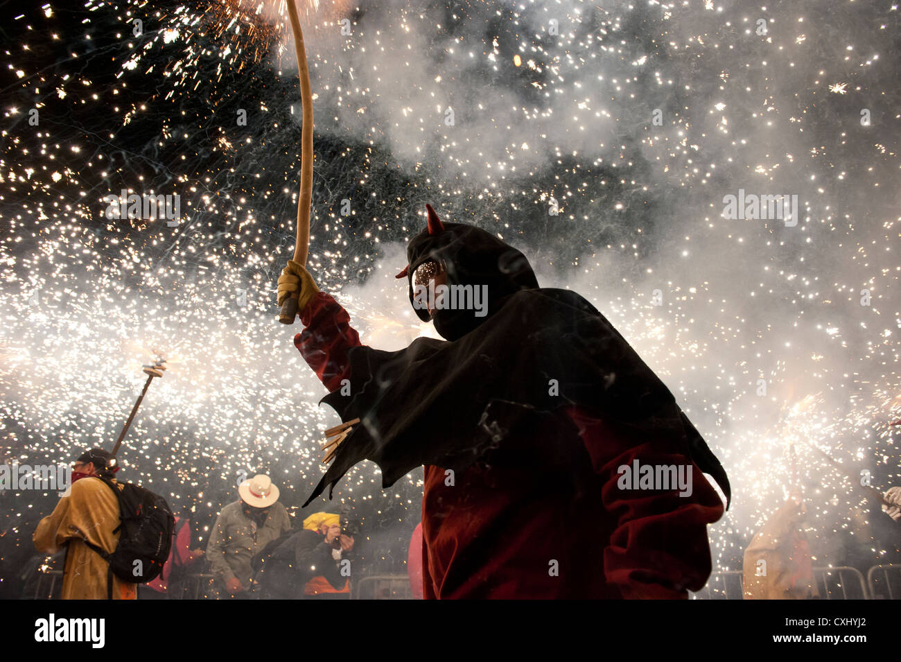Participants in the traditional Correcfoc in the streets of Barcelona ...