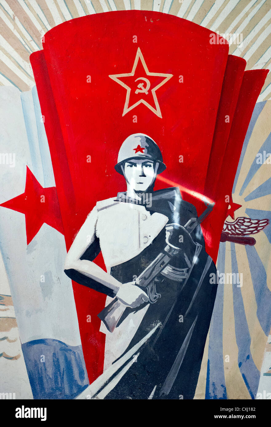 russian coldwar wall painting in abandoned building Stock Photo