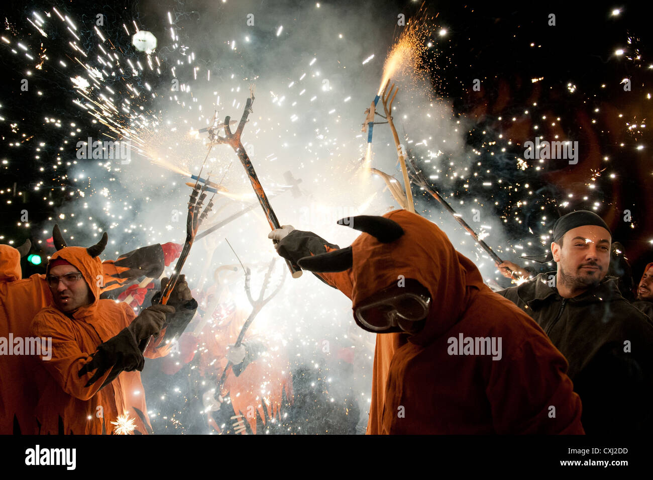 Participants in the traditional Correcfoc in the streets of Barcelona ...