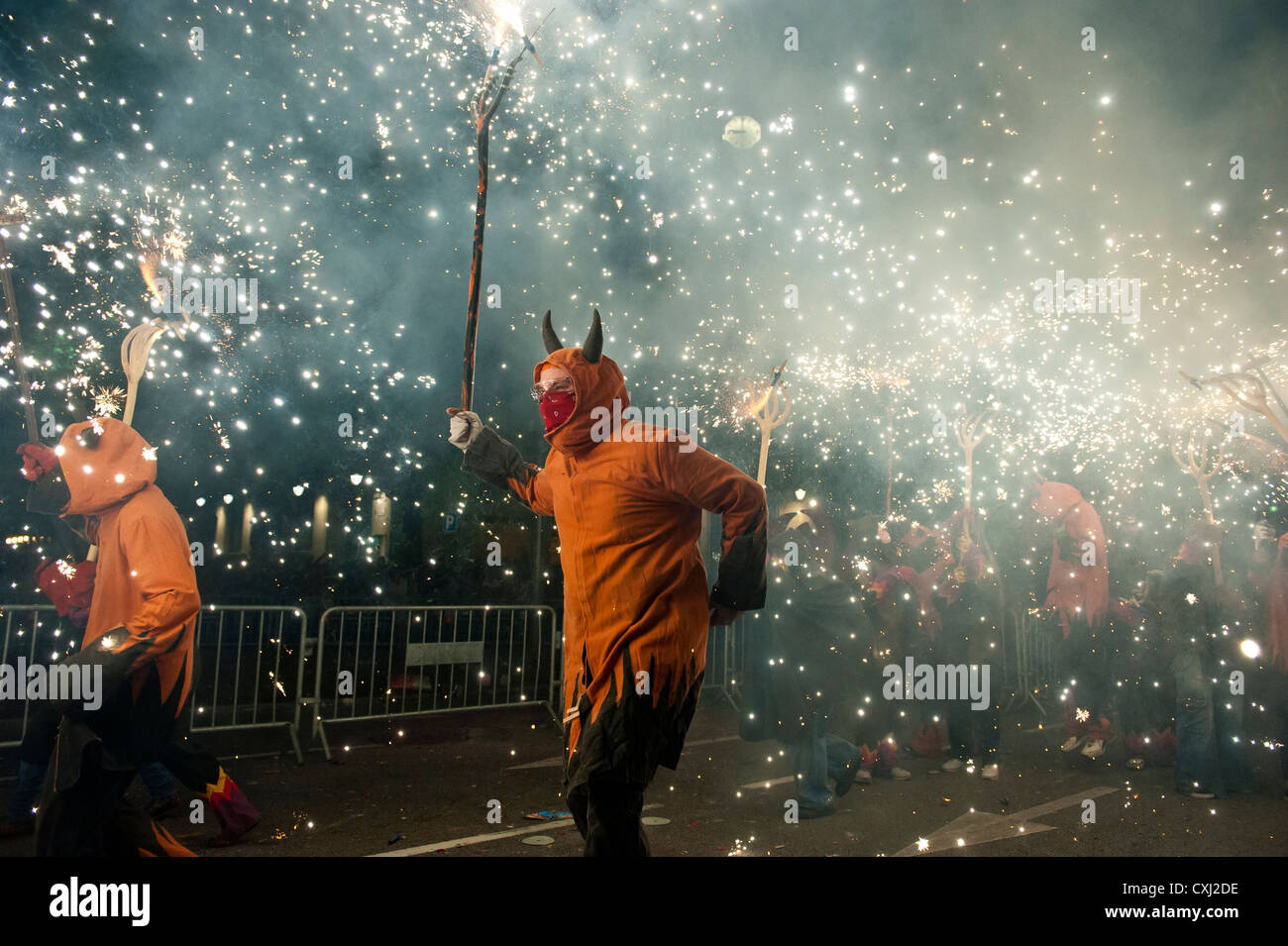 Participants in the traditional Correcfoc in the streets of Barcelona ...