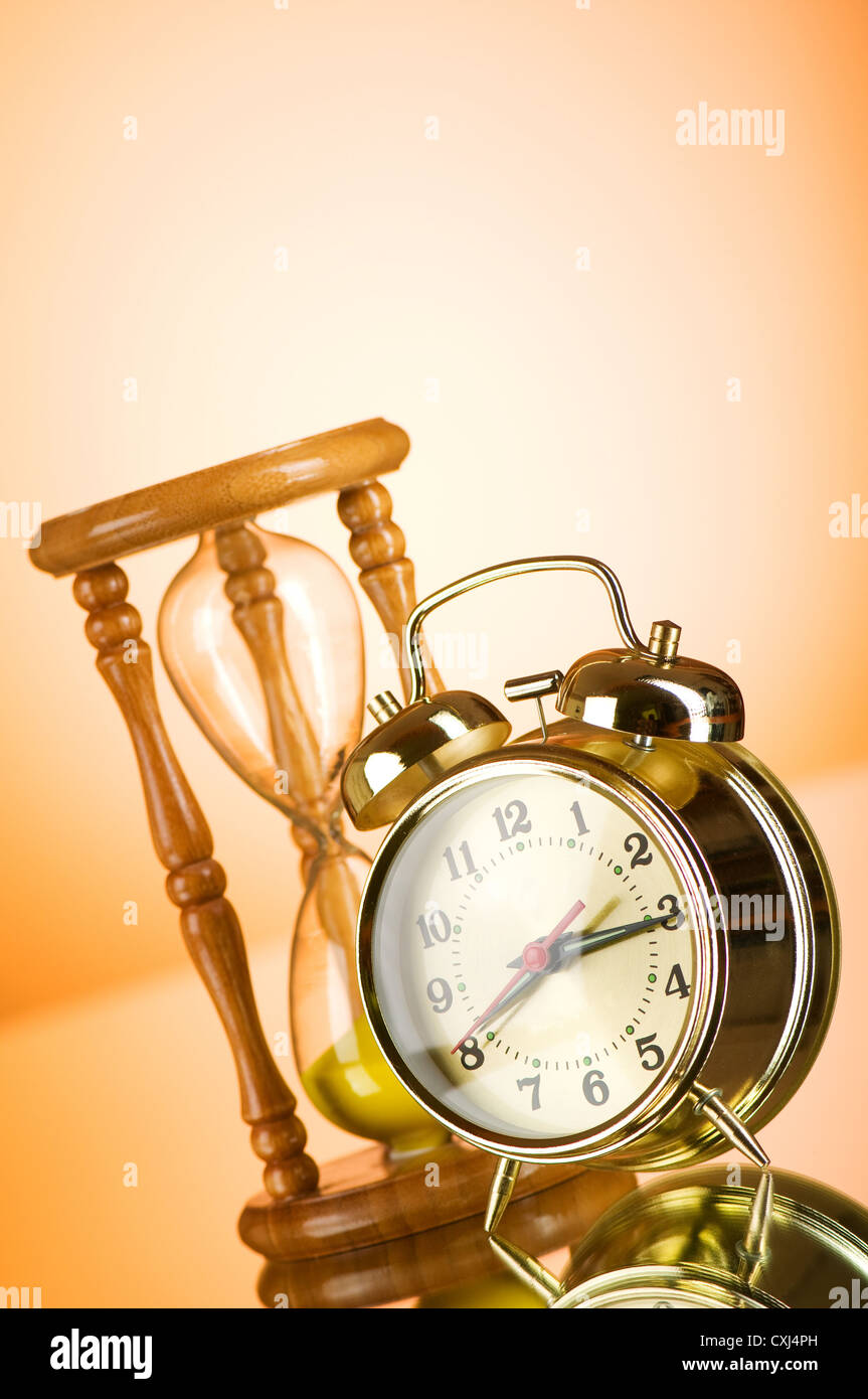 Time concept with clock and hour glass Stock Photo Alamy