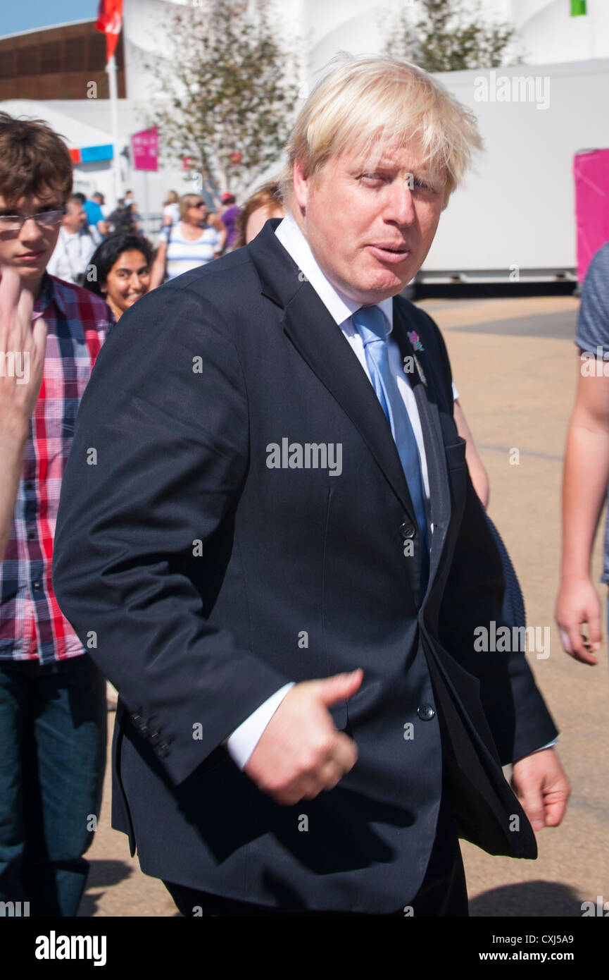 London 2012 Paralympics , Olympic Park Stratford , Lord Mayor Boris Johnson greats crowd while dashing round venue Stock Photo