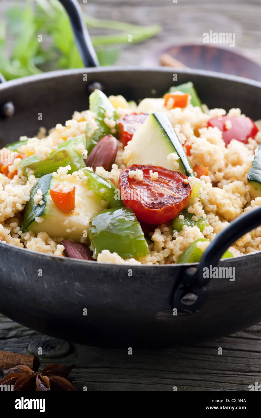 Kuskus with vegetable as closeup in a WOK Stock Photo - Alamy