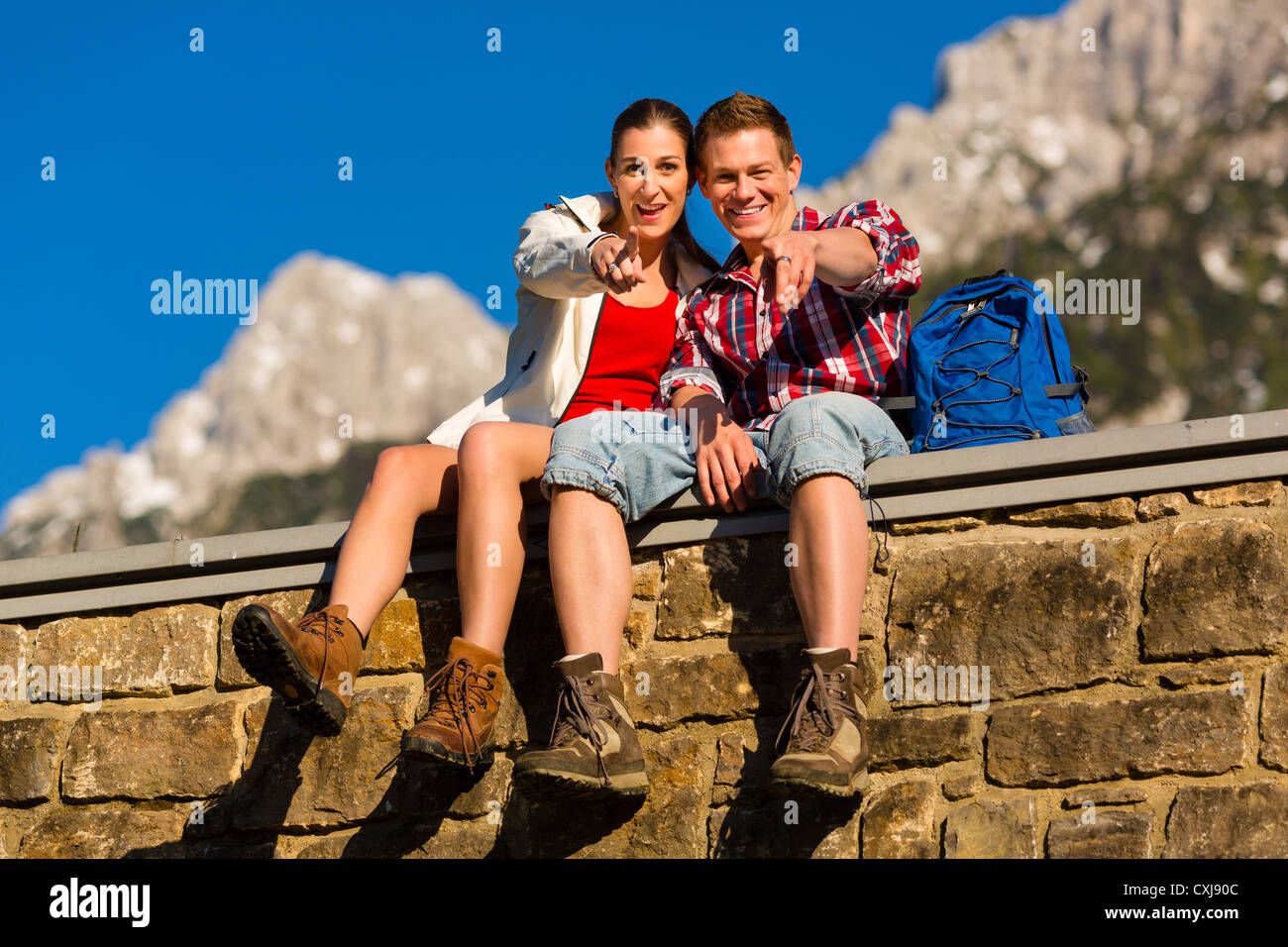 Happy man woman hiking mountains hi-res stock photography and images ...
