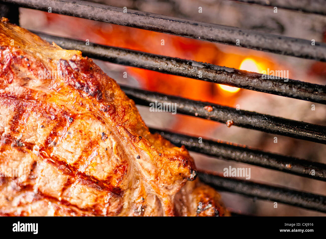 USA, Texas, Rib eye steak on barbecue grill Stock Photo Alamy