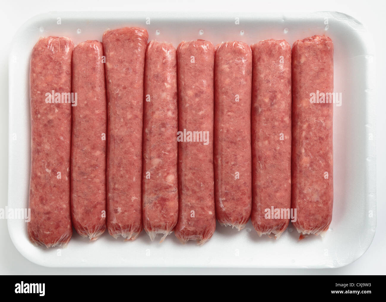 A supermarket expanded polystyrene tray with raw beef veal sausages viewed from above Stock Photo