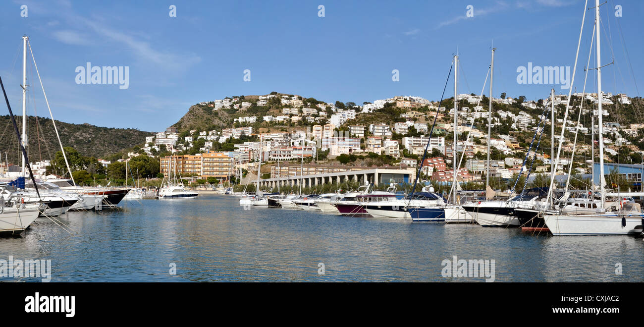 Panoramic photo of port and town of Roses, or Rosas, commune on the Costa Brava at northeastern Catalonia in Spain Stock Photo