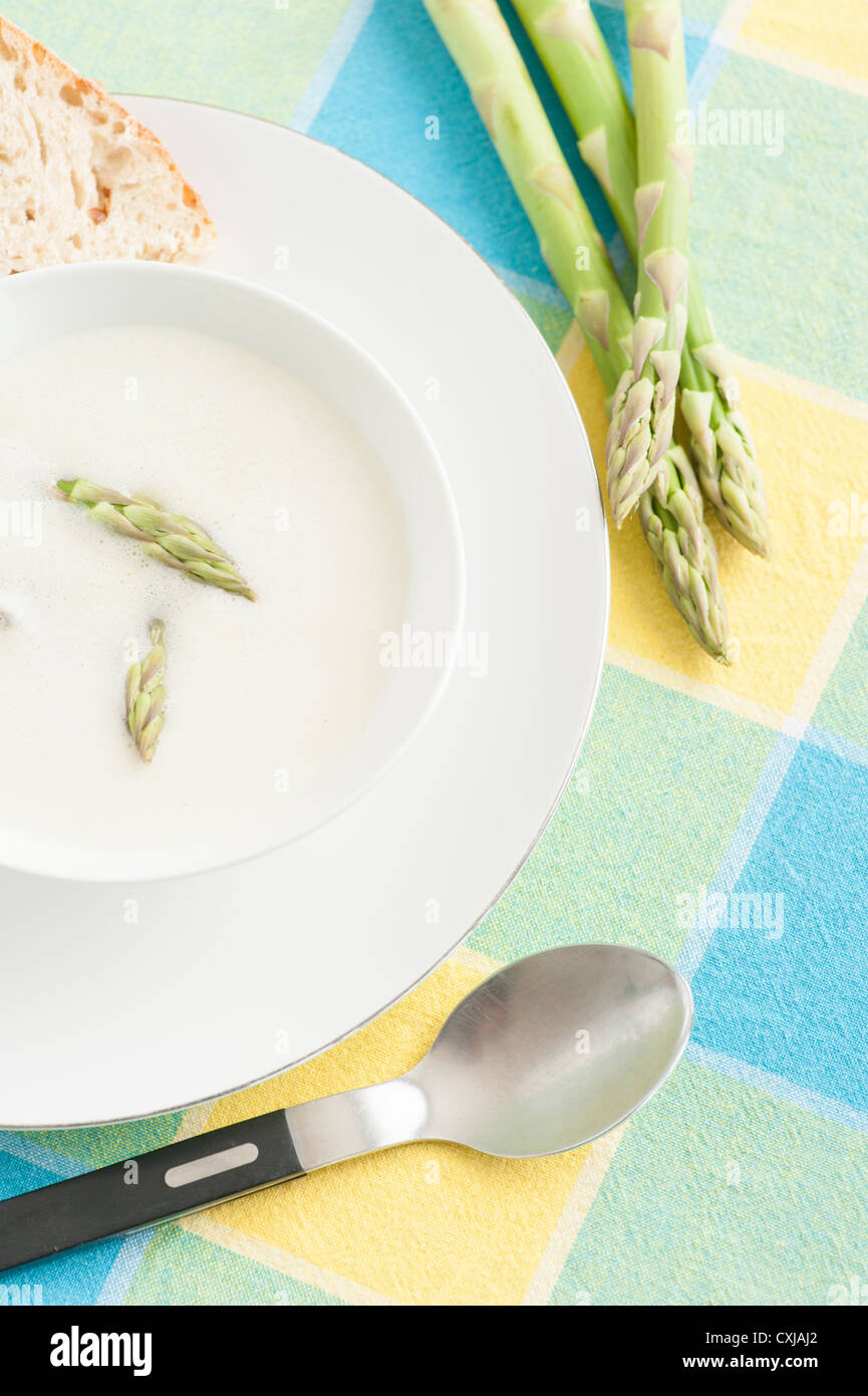 Mixed creamy asparagus soup garnished with green asparagus Stock Photo