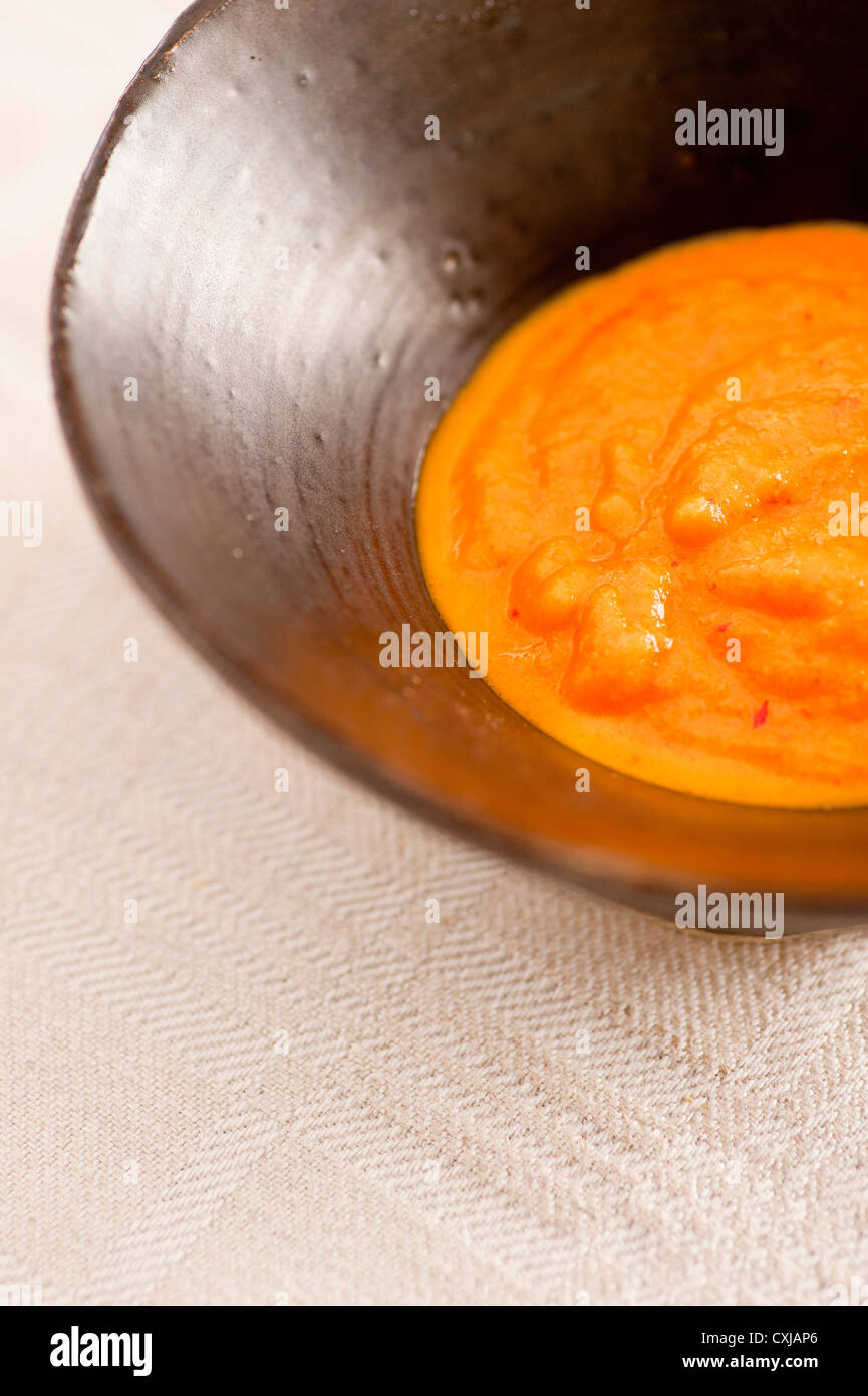 Bowl of spicy hot chili dressing Stock Photo