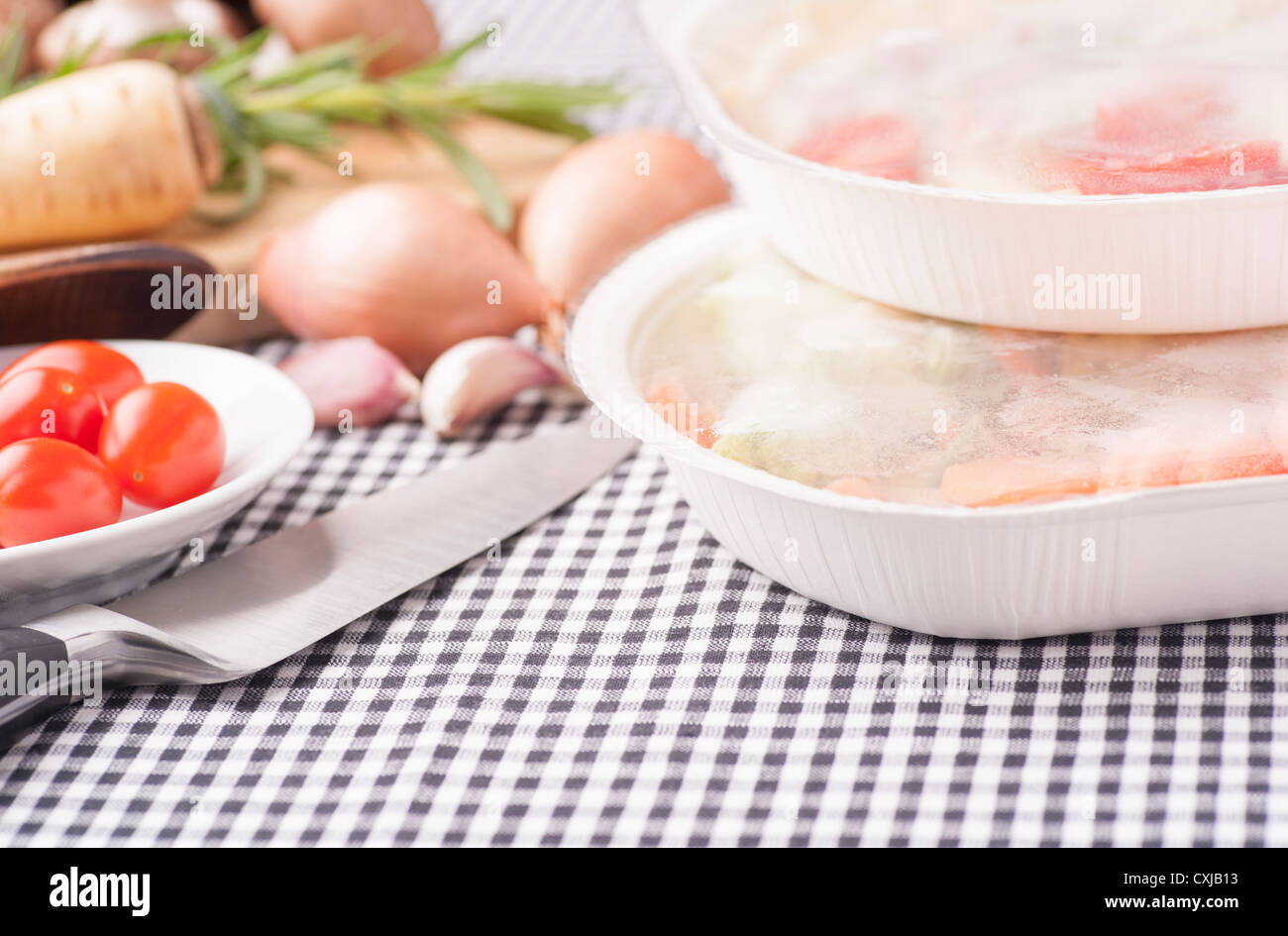 Contrasting food, choice between fresh healthy vegetables and microwave meal Stock Photo