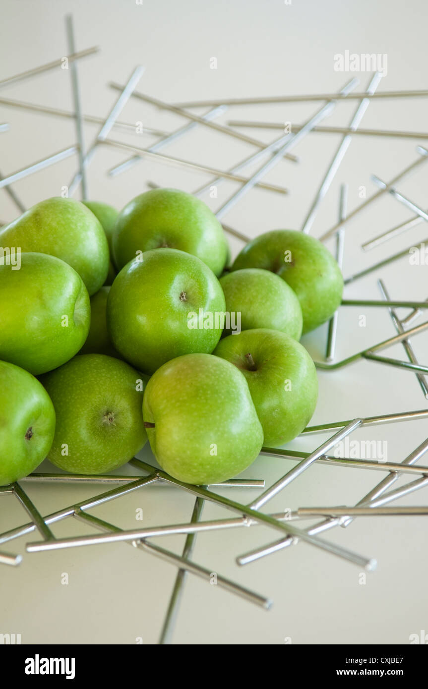 https://c8.alamy.com/comp/CXJBE7/fresh-apples-on-steel-designed-fruitbowl-CXJBE7.jpg