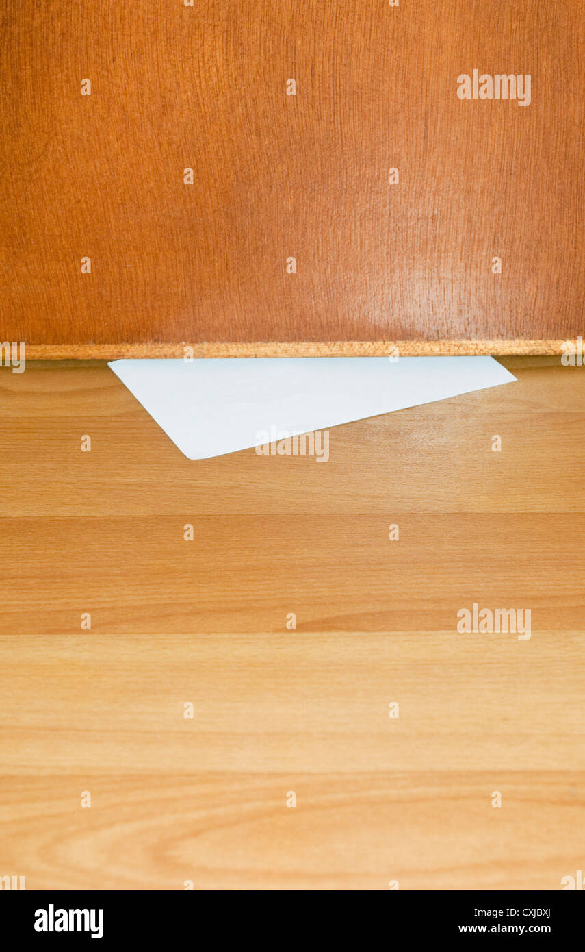 Paper Slipped Under Wooden Door Stock Photo 50806298 Alamy