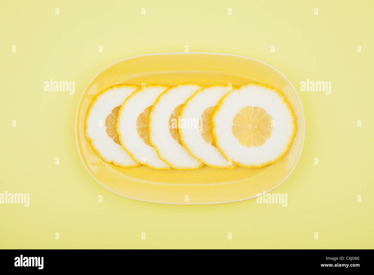 Lemon slice on plate Stock Photo