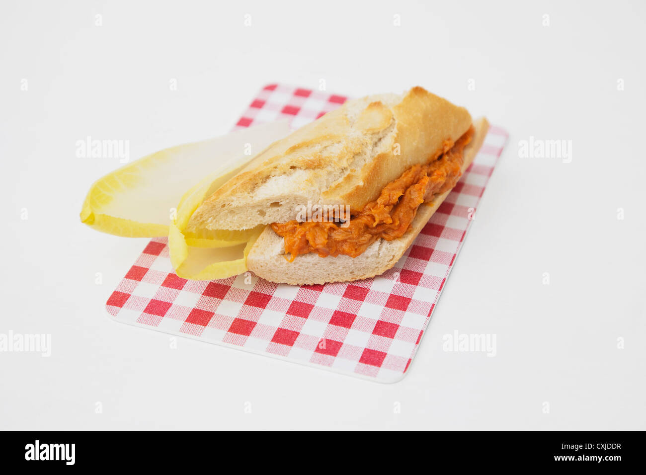 Baguette sandwich with tuna and tomato on board Stock Photo