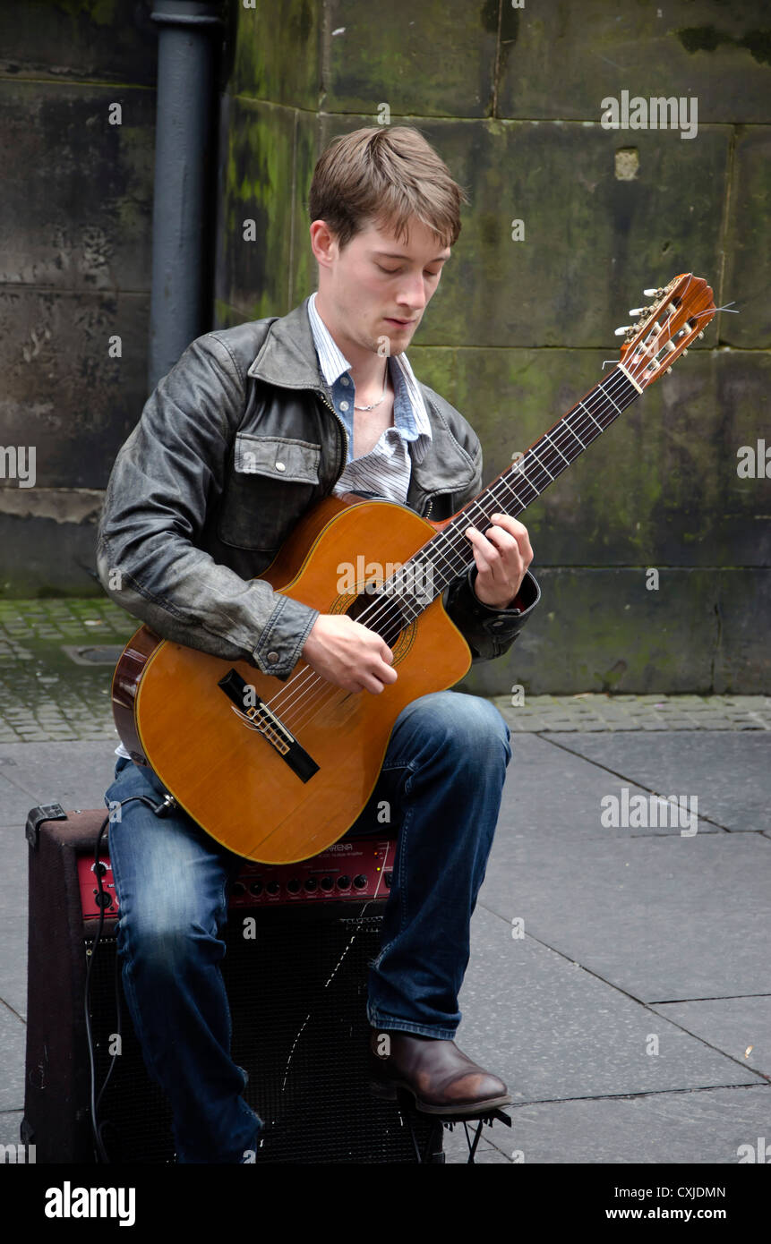 Classical guitarist busking in the Royal Mile, Edinburgh, Scotland