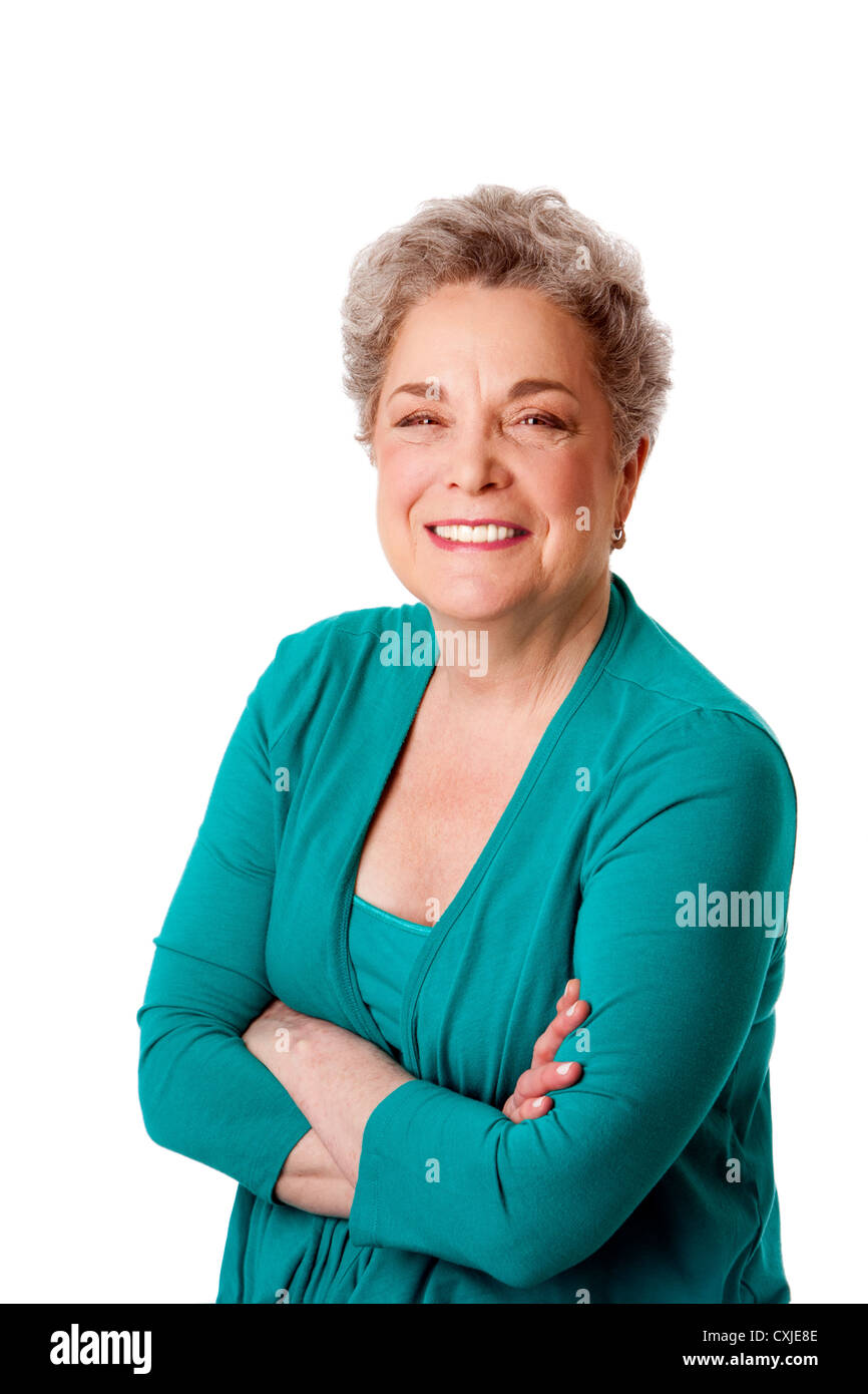 Happy smiling senior woman with arms crossed Stock Photo