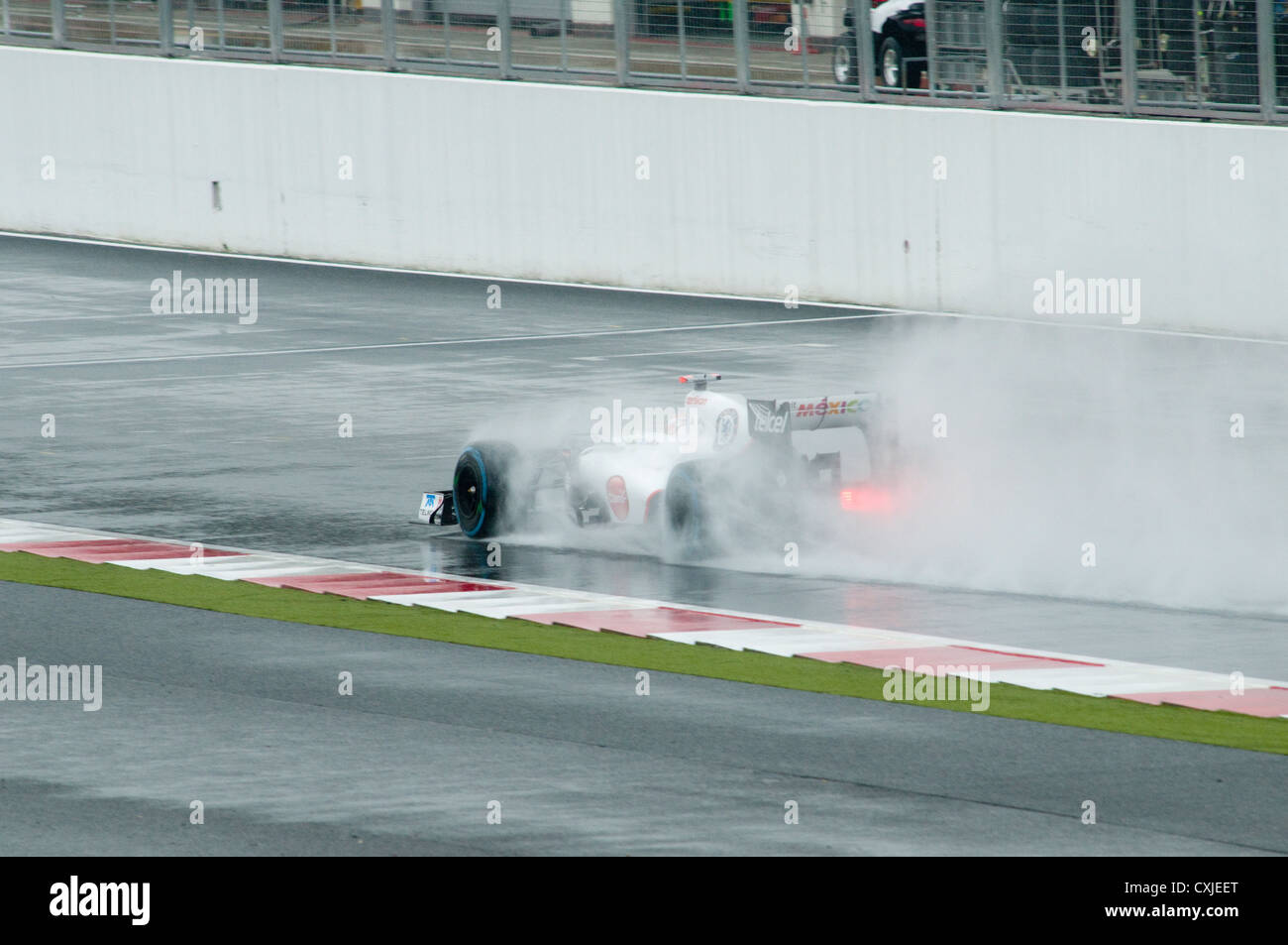 Formula One Car in action in the Rain Stock Photo