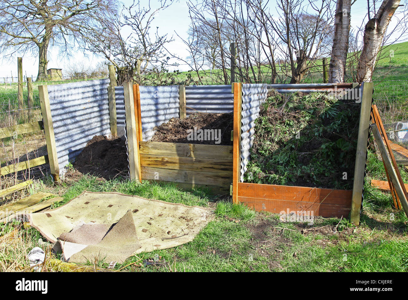 A home made 3 three bin compost heap garden bins Stock Photo