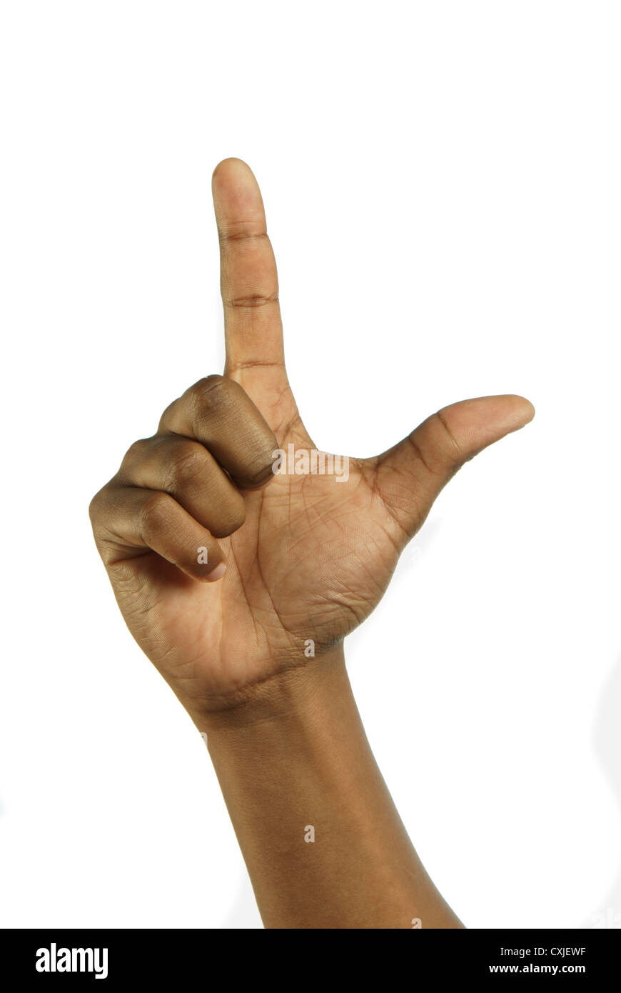 African's hand with forefinger pointing and thumb outstretched to signal number one Stock Photo