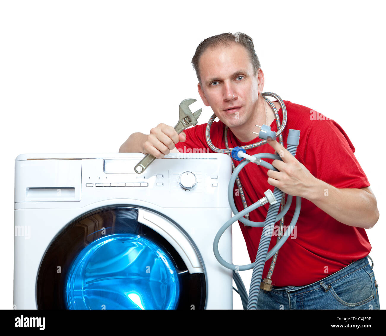 The repairman near the washing machine Stock Photo Alamy