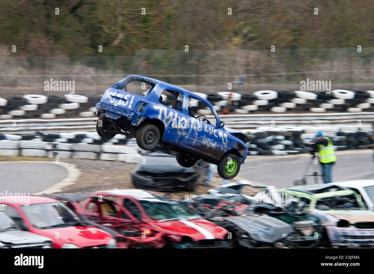 Car Jumping Over Other Cars at a Banger Race Stock Photo Alamy
