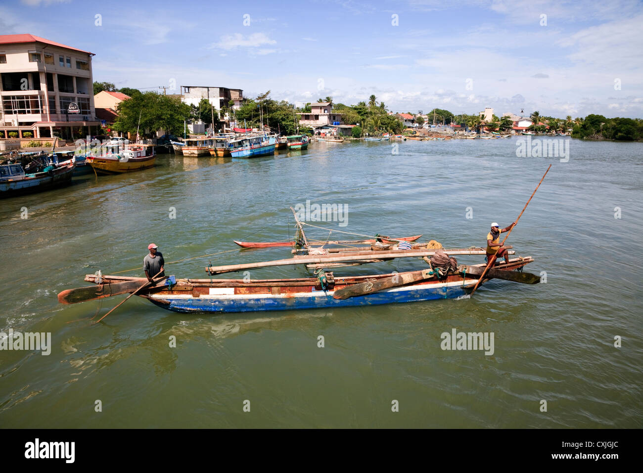 Traditional catamaran used by fishermen in Sri Lanka sailing in the Negombo lagoon Stock Photo